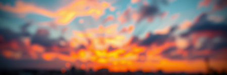 Vibrant sunset with colorful clouds illuminating the evening sky over the horizonの素材