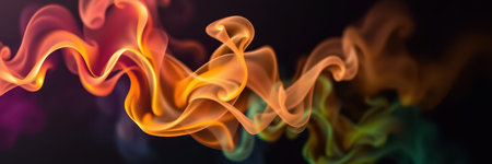 Colorful smoke patterns create an abstract display of swirling shapes in dark backgroundの素材