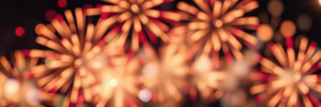 Colorful fireworks illuminate the night sky during a festive celebration in an urban areaの素材