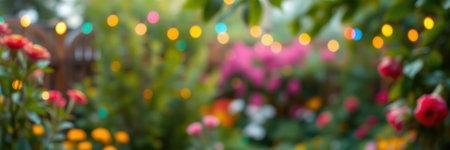 Colorful garden in spring with vibrant flowers and soft glowing lights creating a festive atmosphereの素材