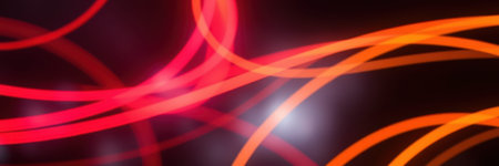 Colorful light trails create an abstract display in vibrant hues at an indoor art installationの素材