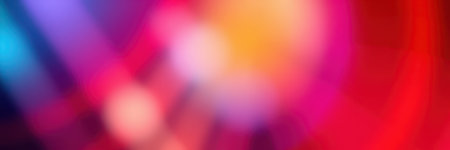 Colorful abstract light patterns create a vibrant atmosphere during a night event in an urban settingの素材