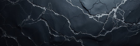 A close-up of black marble with white veinsの素材