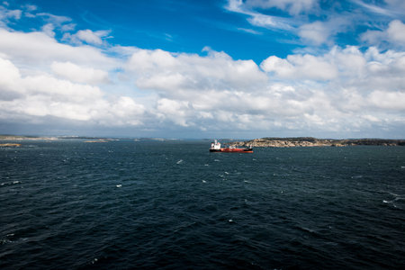 View at the coastline of Gothenburg in Sweden a baltic sea with heavy clouds and big rocks coming...
