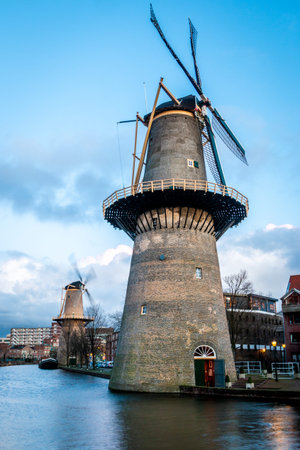 Beautiful windmills in Schiedam province South Holland, the highest windmills in the world also known as burner mills were used for grinding grain that was used for the gin industry.の写真素材
