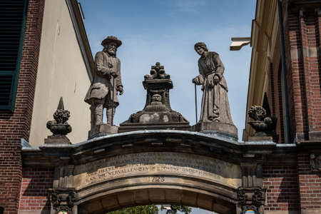 Sculptures above a gate in the hanseatic city of Zutphen in the Netherlands, province of Gelderlandの写真素材