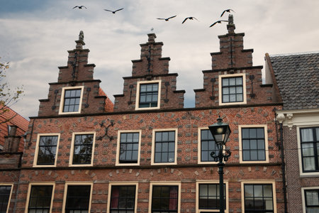 Typical Dutch architectural style of the facades of the houses in the city of Alkmaar, the...