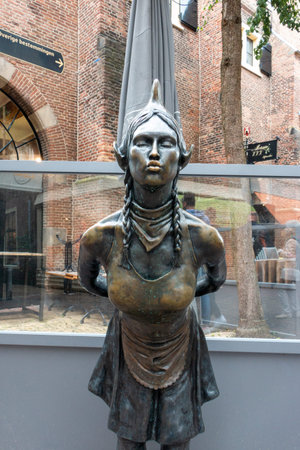 The Kissing Cheese Girl in Alkmaar, a famous statue in the cheese town of Alkmaar, the Netherlandsのeditorial素材