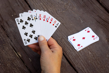 A handful of playing cards, to play the favorite game of belote, with four people, photo taken in...
