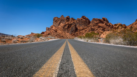 Driving and walking through the Valley of Fire State Park, formed by shifting sand dunes to red...