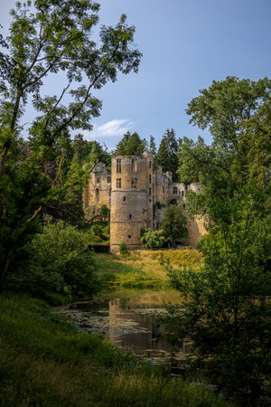 The medieval dilapidated ruin with the name 'chateau Beaufort' in the town of Beaufort, a castle that attracts many tourists, Luxembourgの写真素材