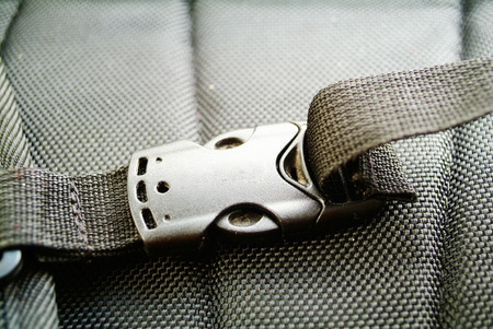 Black plastic buckle on strapの写真素材