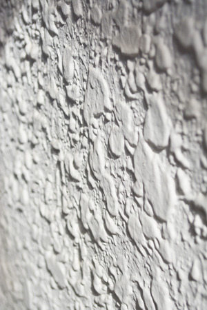 Closeup grunge texture on white cement wall.の写真素材