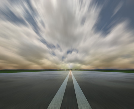 Empty asphalt road with sunset skyの写真素材