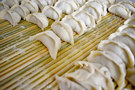 raw dumpling on bamboo wickerworkの写真素材