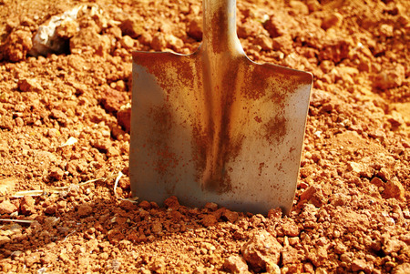 Soil with shovel. Close-upの写真素材