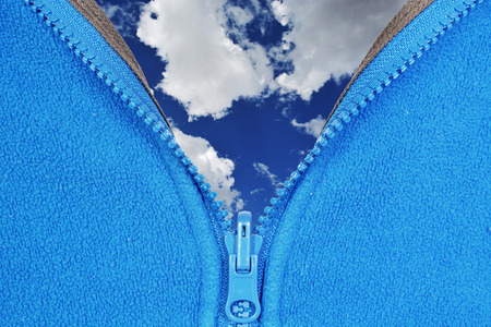 One open zipper isolated on black backgroundの写真素材