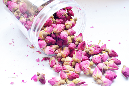 Dry rose bud in glass bottle.の写真素材