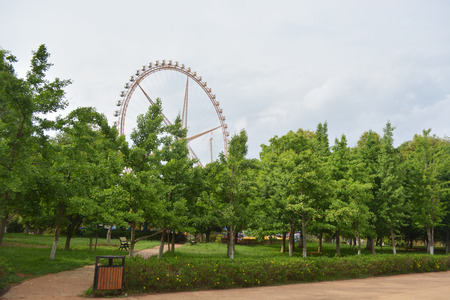 Ferris wheel against a blue sky on a sunny dayのeditorial素材