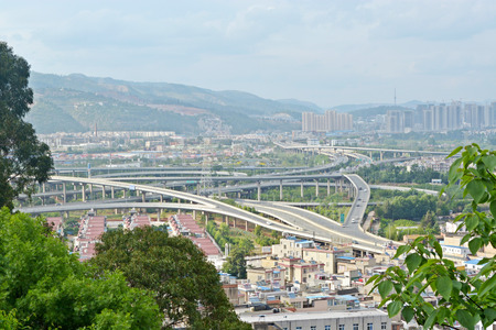 Highway overpass motion blur with city background .のeditorial素材