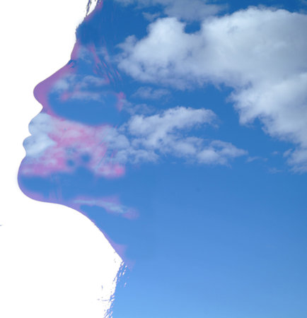 head silhouette with cloudy sky inside