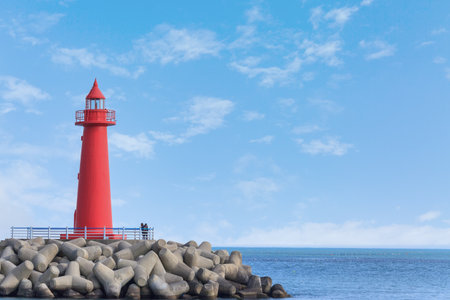 a landscape with a blue sky and a lighthouseの写真素材