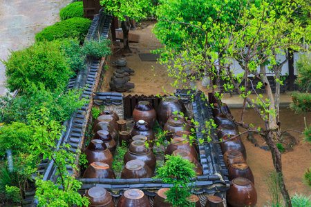 Platform for crocks of sauces and conditions in old traditional houseの写真素材
