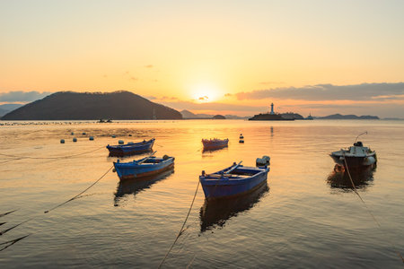 A sunrise in the sea at Sagungdumi Port in Masan, Koreaの写真素材