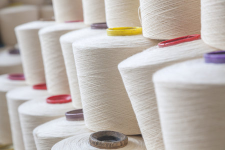 cotton threads roll in reels stacted together