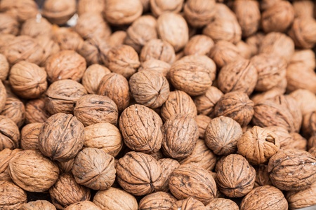 walnuts stacked in the market placeの写真素材