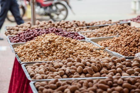roasted almond stacked in the market placeの写真素材
