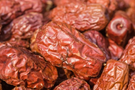 preserved red date stacked in the market placeの写真素材