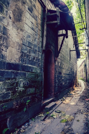 aged alley with stone wallの写真素材