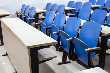 tables and chairs in a empty classroomの写真素材