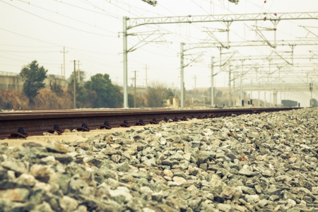 railroad metal track with track bedの写真素材
