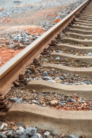 railroad metal track with track bedの写真素材