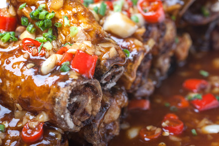 eggplant roll fried with flour covered with  chili sauce, a popular Chinese dishの写真素材