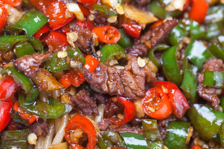 chinese rice noodle with red and green chili sauce stir fried with beef, a popular chinese dishの写真素材