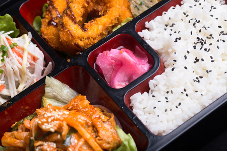 japanese lunch box with ginger salad and kimchiの写真素材