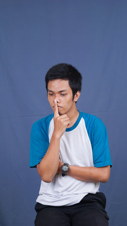 asian man thinking and get ideas and solutionの写真素材