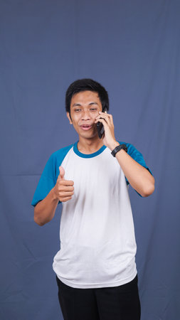 asian man calling and expressionの写真素材