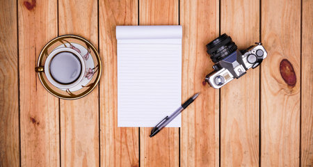 blank white paper notes with coffee and old camera on top wood tableの写真素材