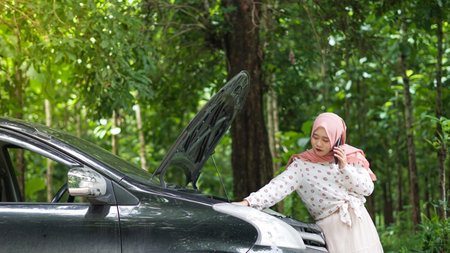 asian women wearing hijab have a trouble with her carの写真素材