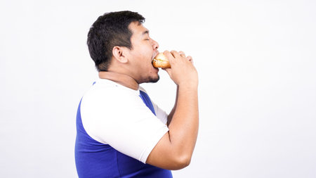 asian man ready to eat burger isolated white background