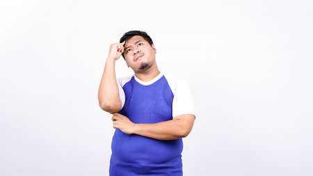 asian man thinking and get idea isolated white backgroundの写真素材