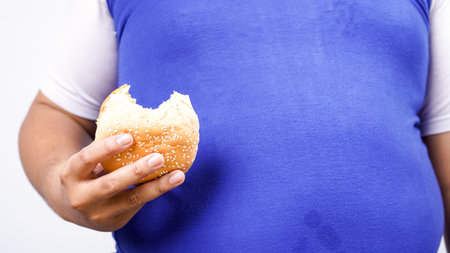 asian man ready to eat burger isolated white background