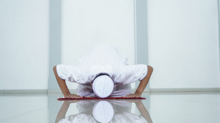 A portrait of an asian muslim man pray at mosque, the pray name is sholat, sujud movement on sholat