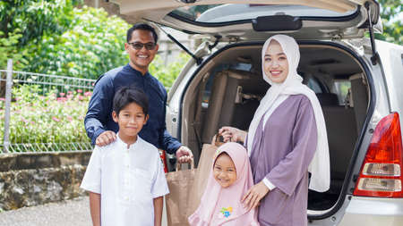 Muslim families travel back to their hometowns by car to celebrate Eidの写真素材