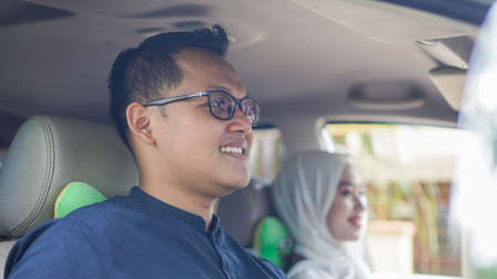 Muslim family in the car will go home to celebrate Eidの写真素材