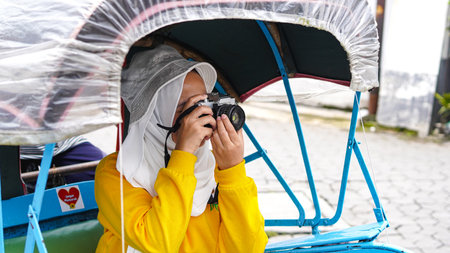 Asian women travel in rickshaws wearing jilbab and analog camera